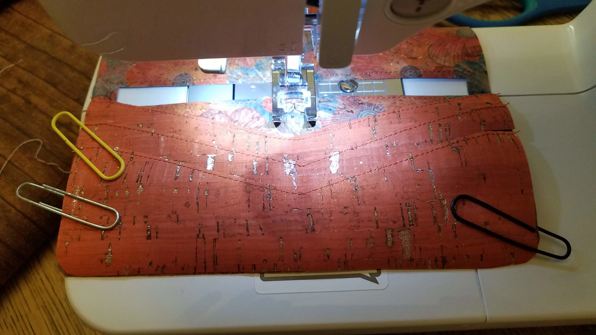 This was the trickiest part, because you can’t pin anything. The sides had to seat themselves and tuck just under each other, so that none of the cork backing was visible. Once again, I used my sturdy large paper clips to hold everything in place.