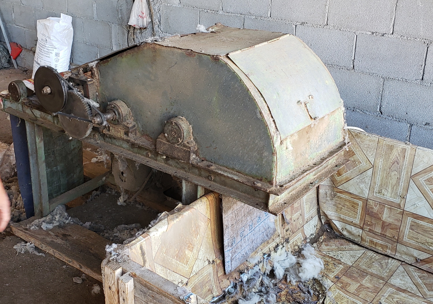 They put the wool through this machine to get some of the worst of the chunks of stuff out