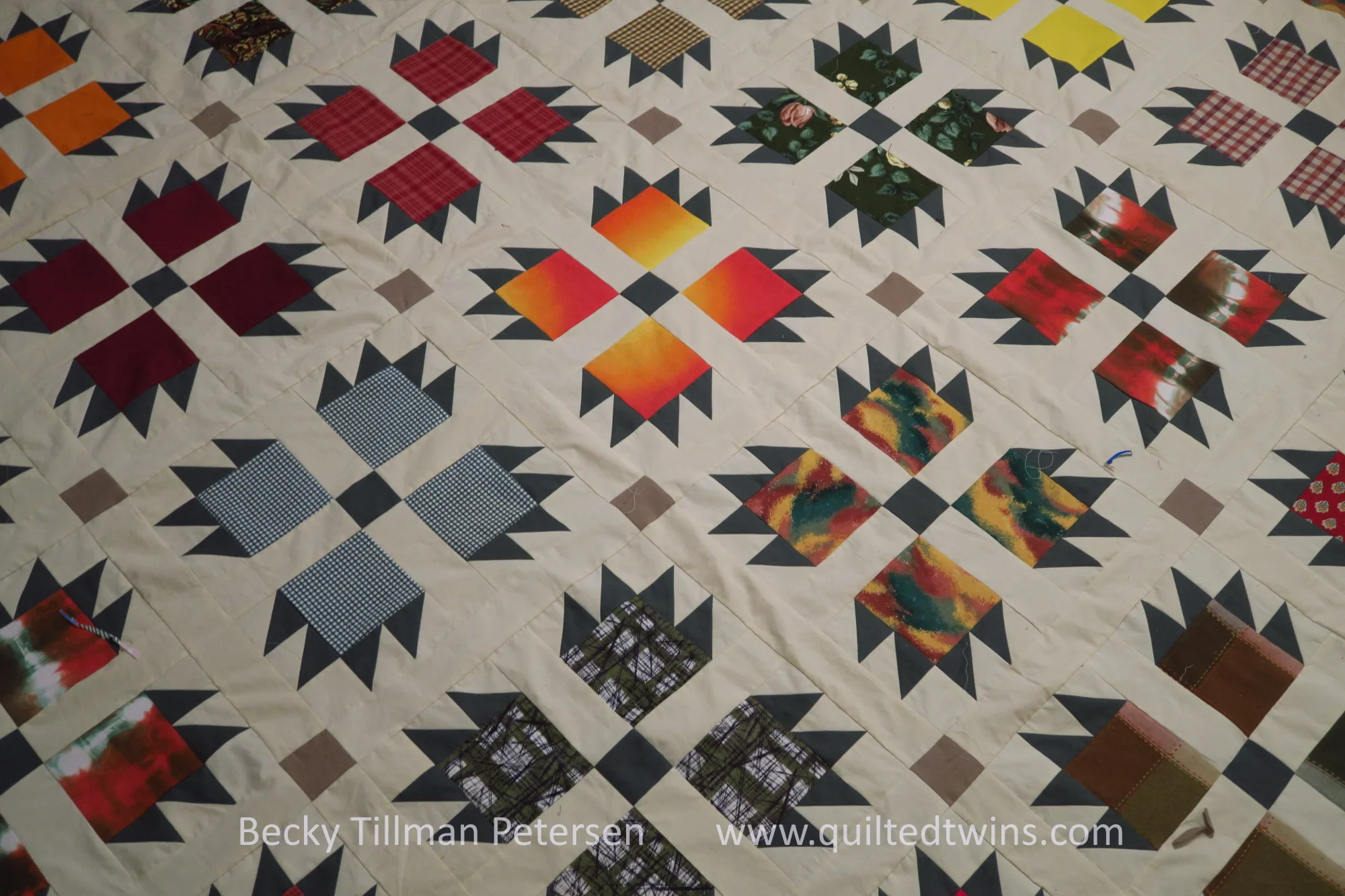 "Bear Paws Deluxe" - upcycled fall colors quilt top finished
