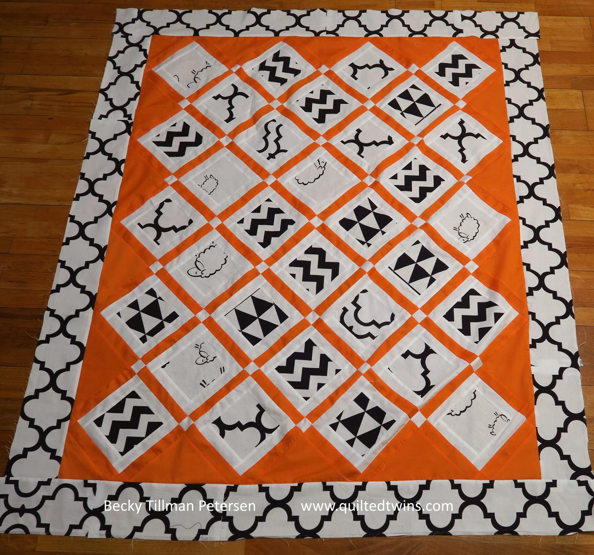 Geometrics 9 - orange and white baby quilt