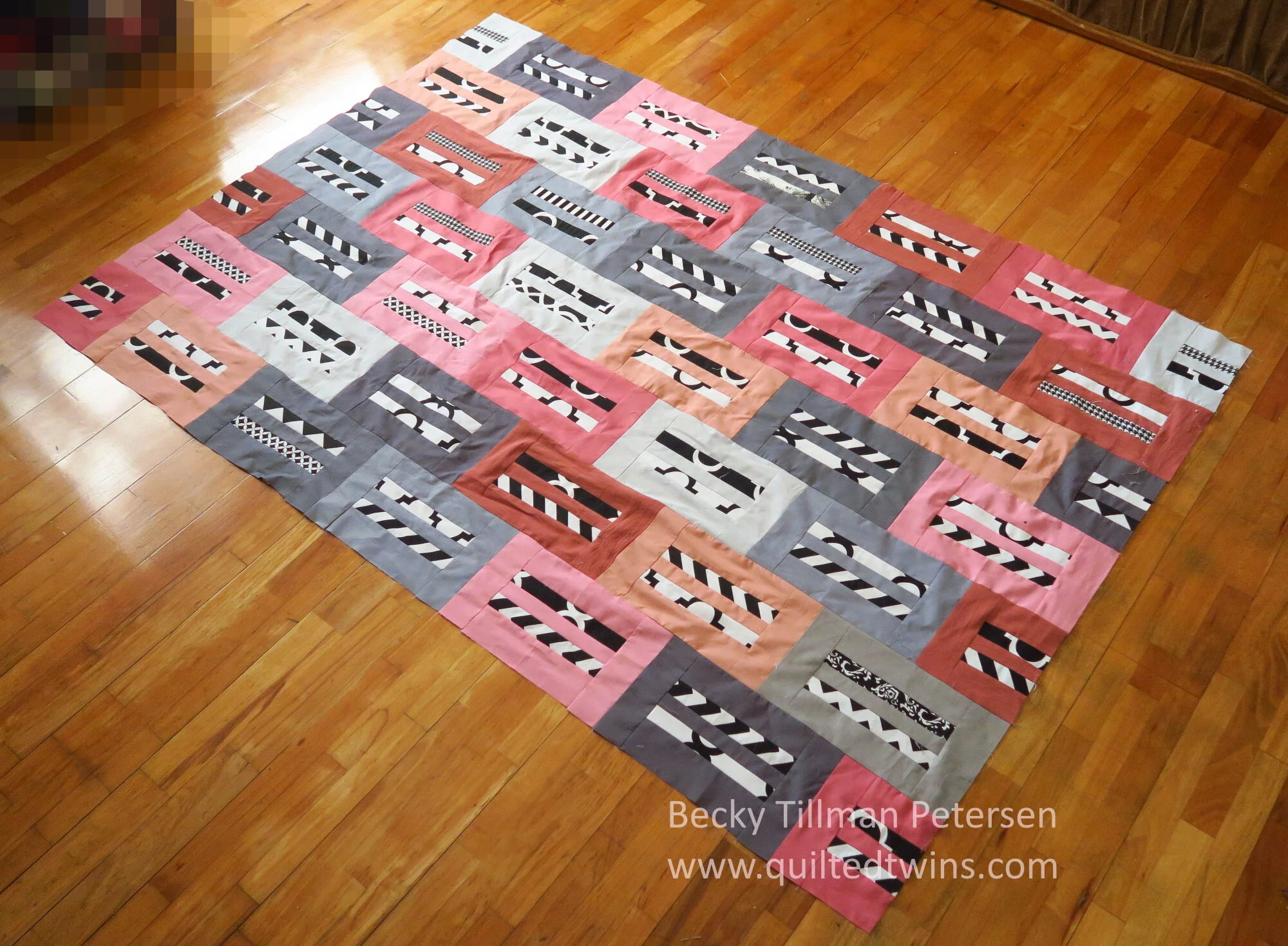 Geometrics 14 - Dusty rose, coral, and gray lap quilt