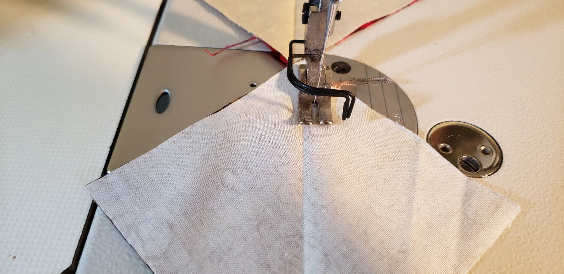 Stitch together, sewing 1/4" to the right of the folded line.