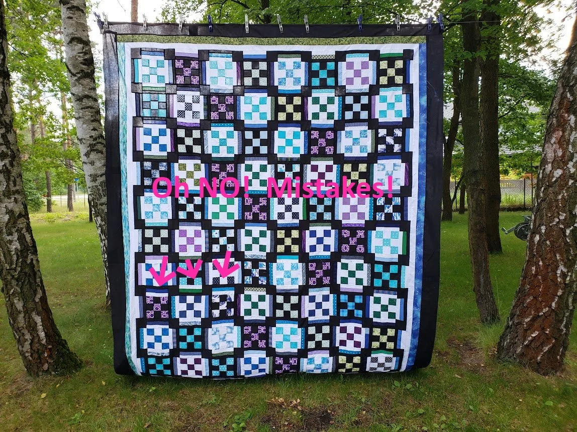 Nine Patch Variation with purples, greens, blues