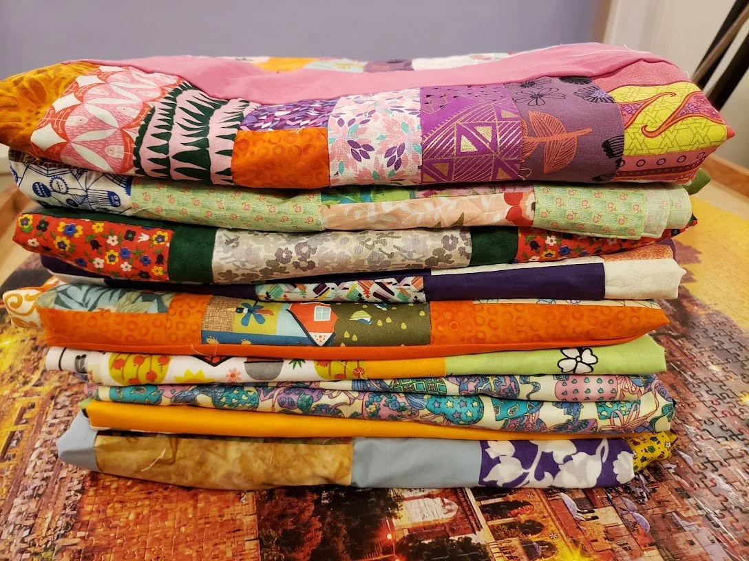 Ten Charity Tops ready to Quilt!