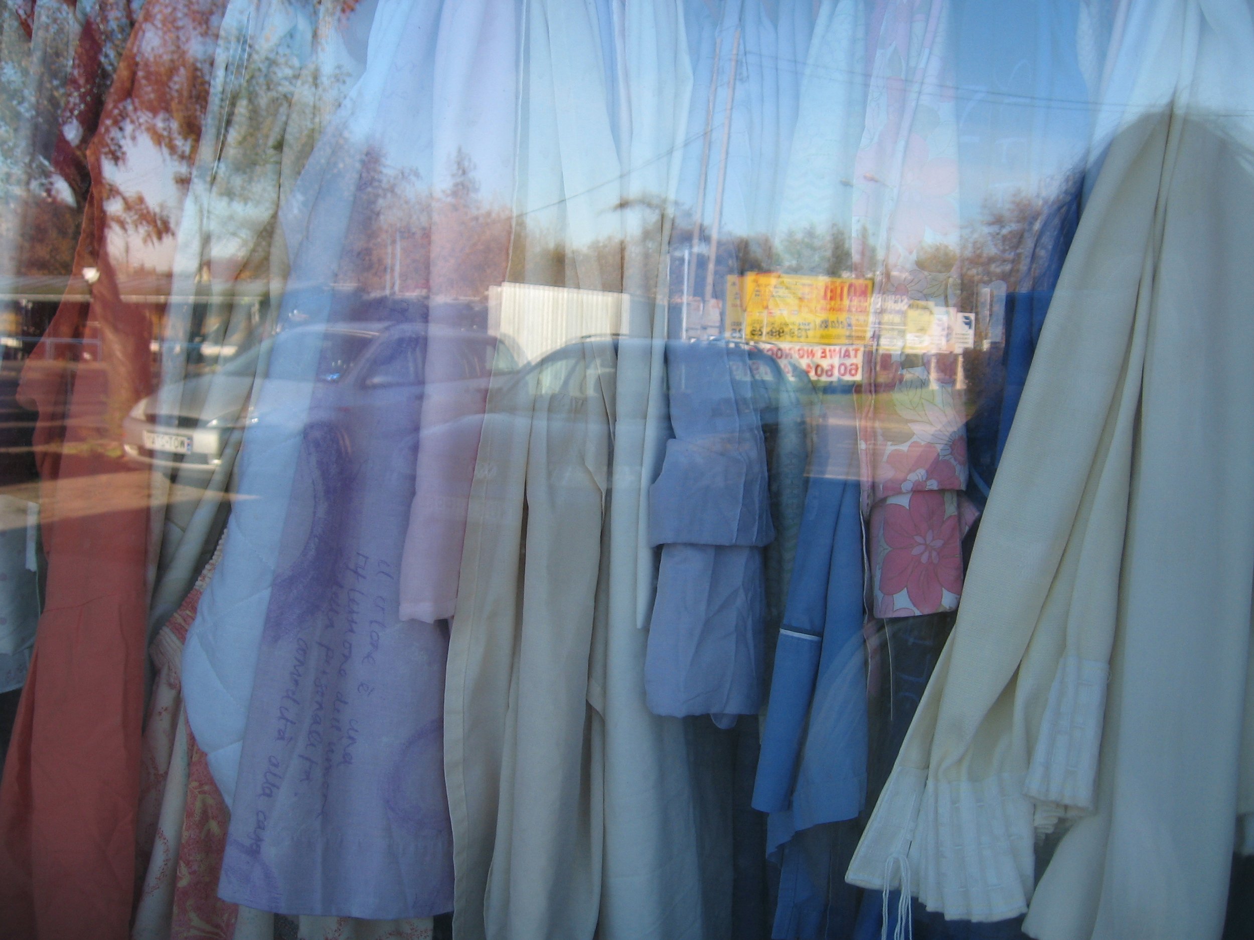 Second hand store - lots of duvet covers/curtains in the window