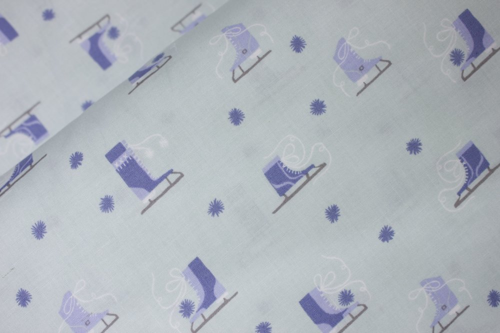 Blue ice skates on aqua - $6.99/yd