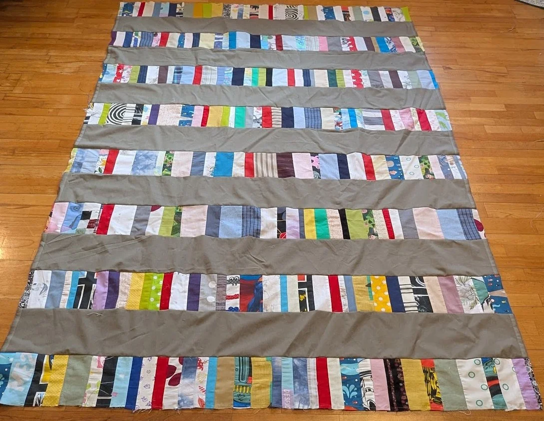 I take the strips that Ewa and her mom make and add a 6.5" strip to them and make these strippy tops.