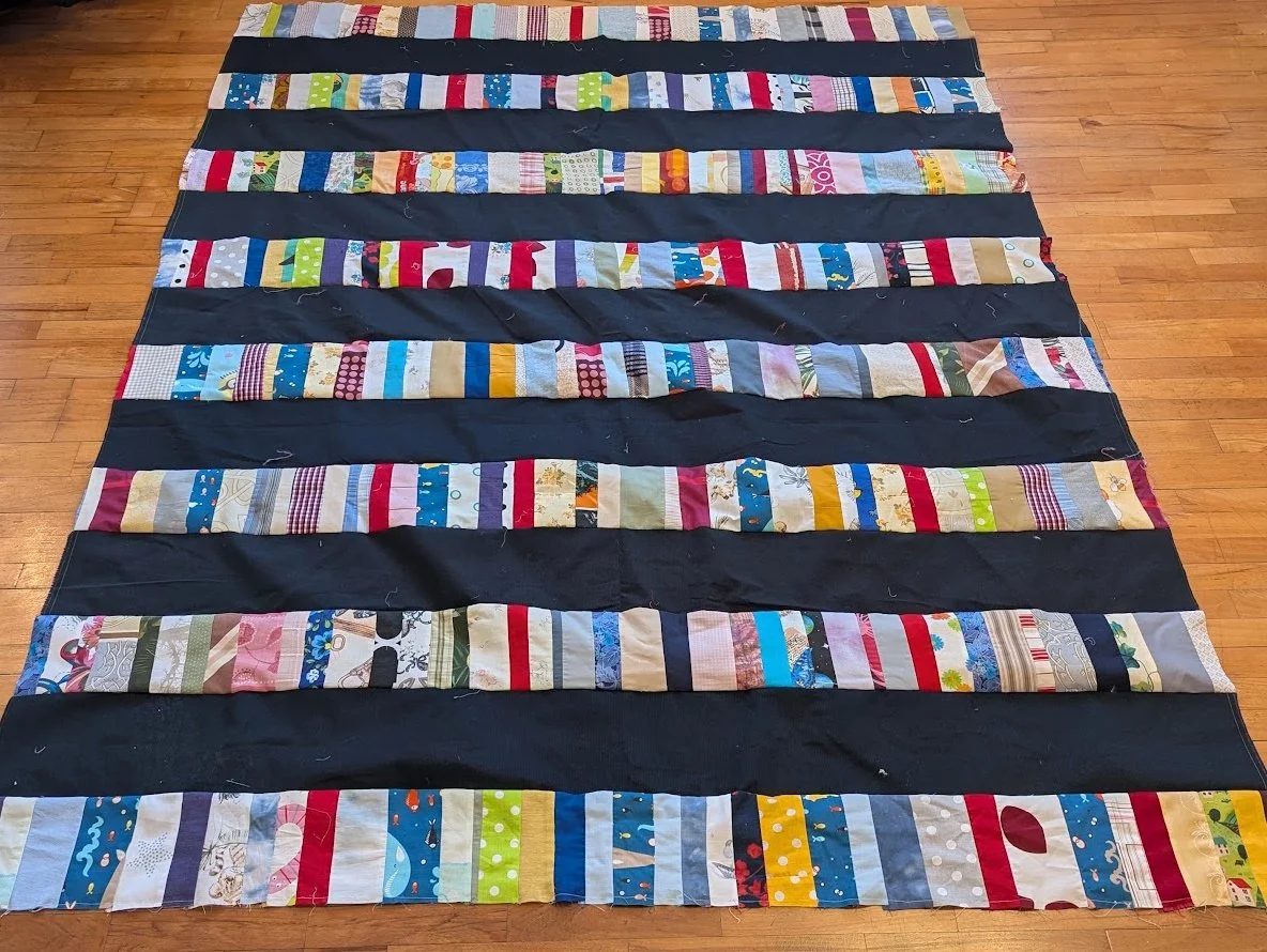 I take the strips that Ewa and her mom make and add a 6.5" strip to them and make these strippy tops.