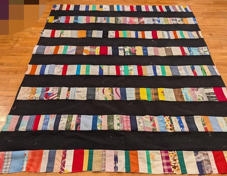 I used strips made from Ewa and her mom and added the long big strips of menswear  to make a top.