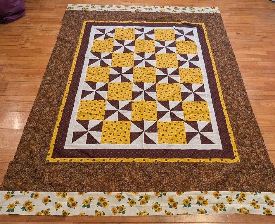 Donated top by someone in the states. I added only the borders.