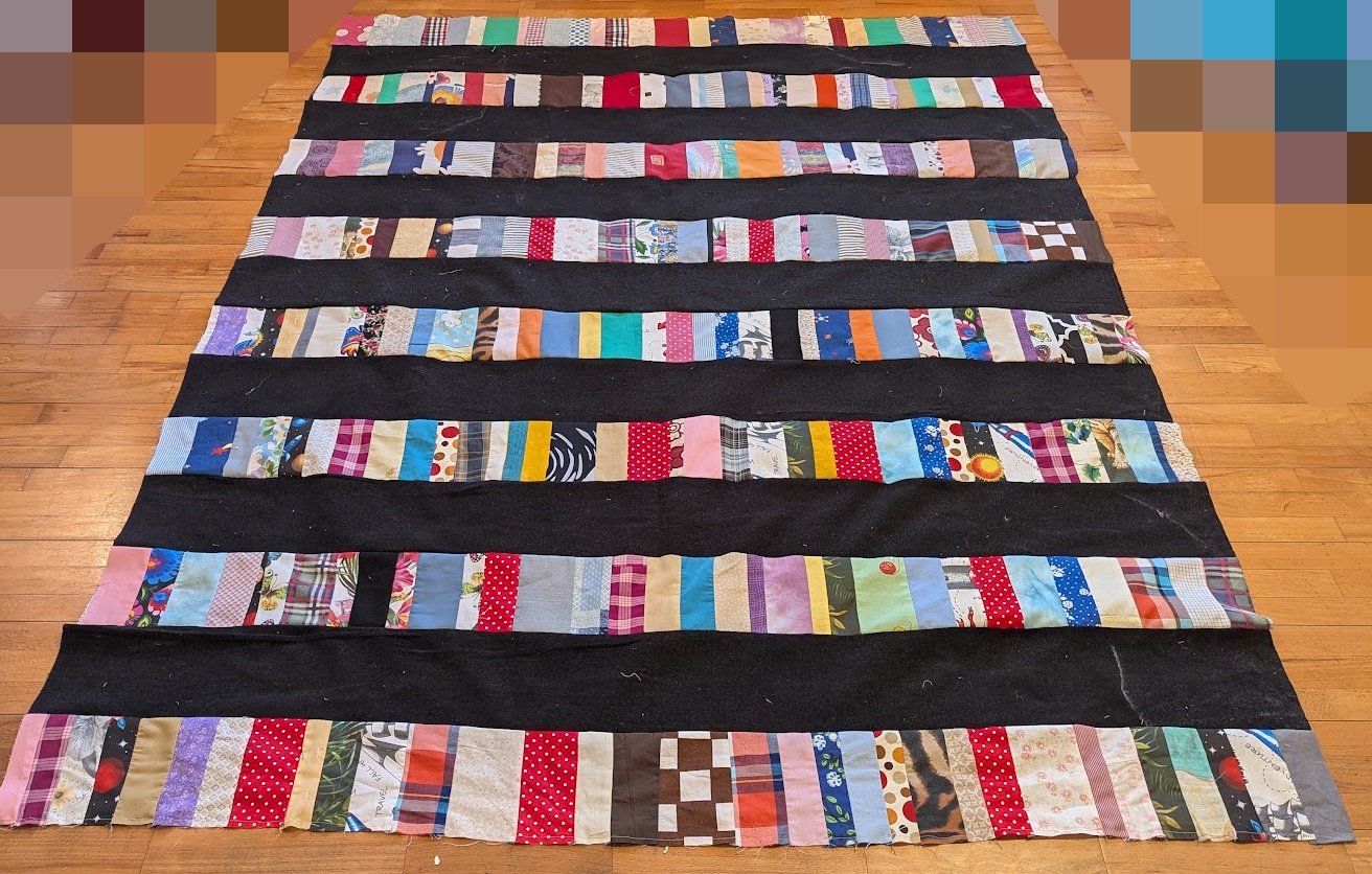 The strips came in a bag from Ewa and her mom and I cut the wide 6.5" strips from menswear and sewed them together.