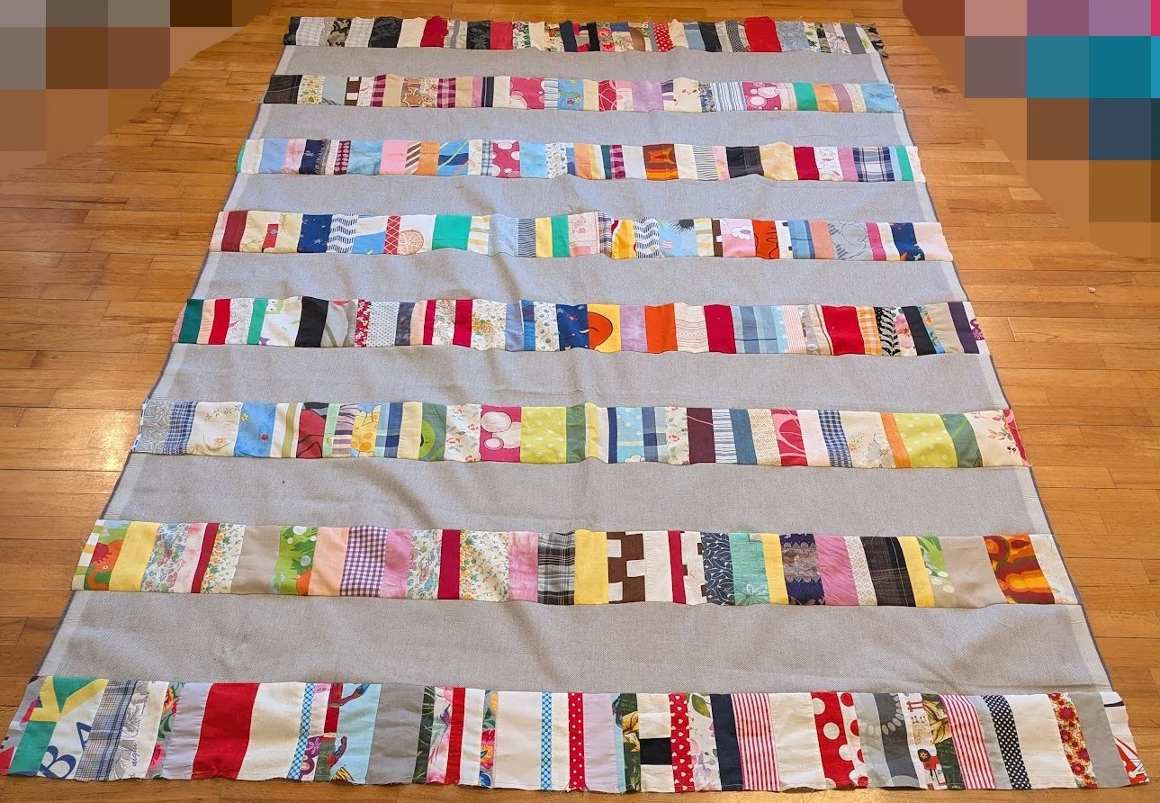 The strips came in a bag from Ewa and her mom and I cut the wide 6.5" strips from menswear and sewed them together.