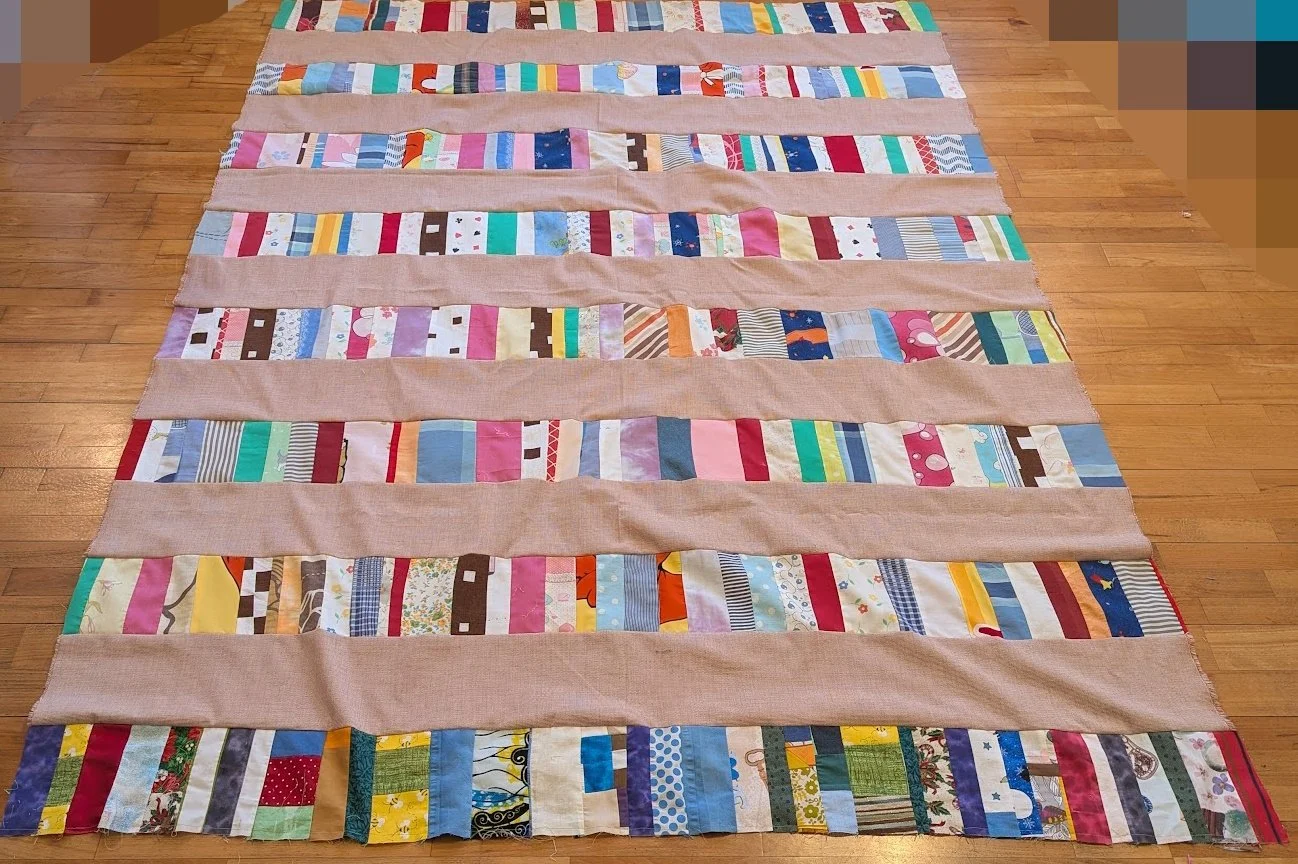 The strips came in a bag from Ewa and her mom and I cut the wide 6.5" strips from menswear and sewed them together.