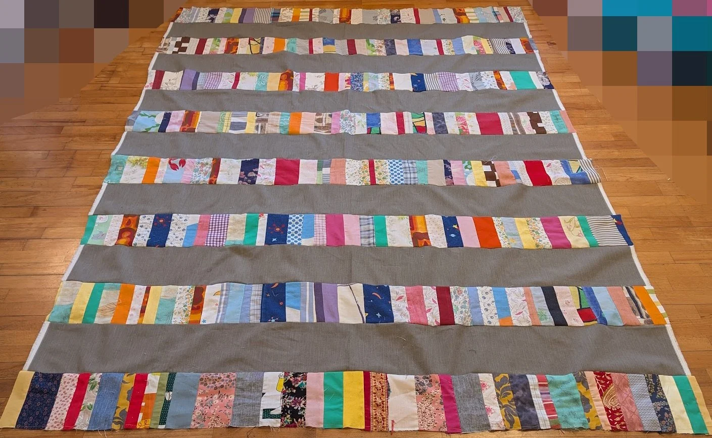 The strips came in a bag from Ewa and her mom and I cut the wide 6.5" strips from menswear and sewed them together.