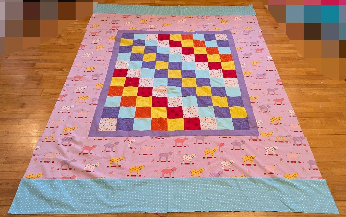 I added the borders from the lavender out. Fran made the center.