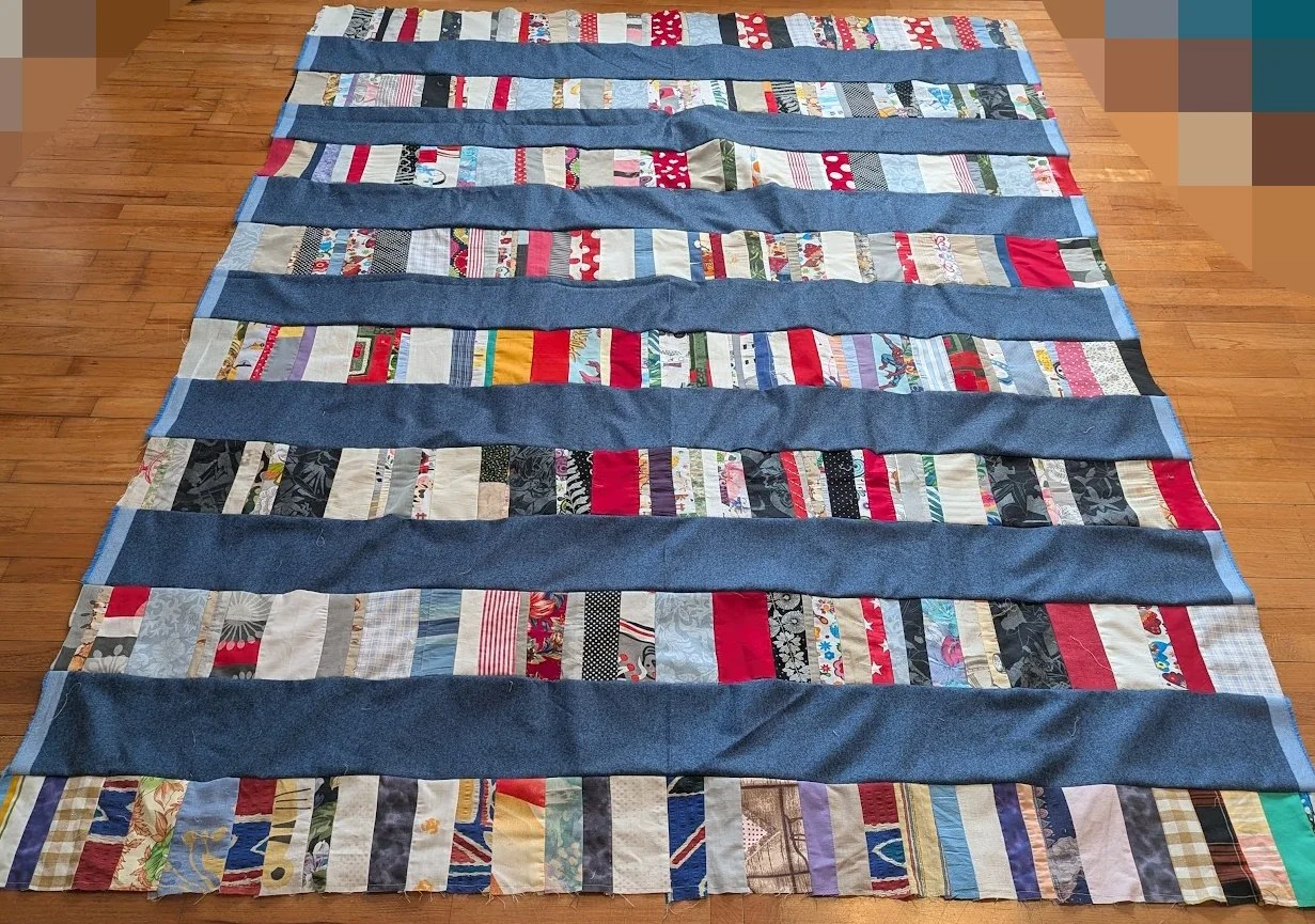 I used strips that Ewa's mom made which were rolled up and cut 6.5" strips x WOF from menswear I have and sewed them together to make this top.