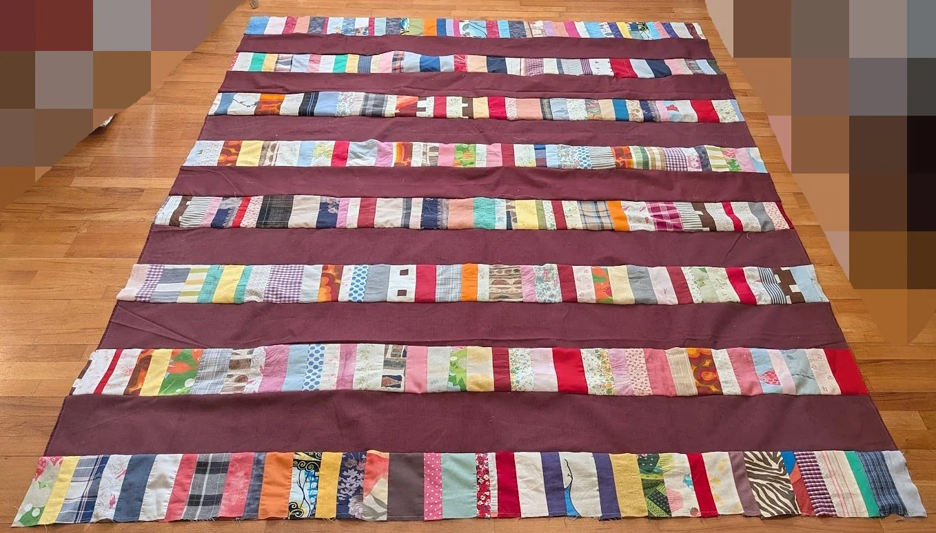 I added the strips to 6.5" cuts from the menswear fabric - the whole top