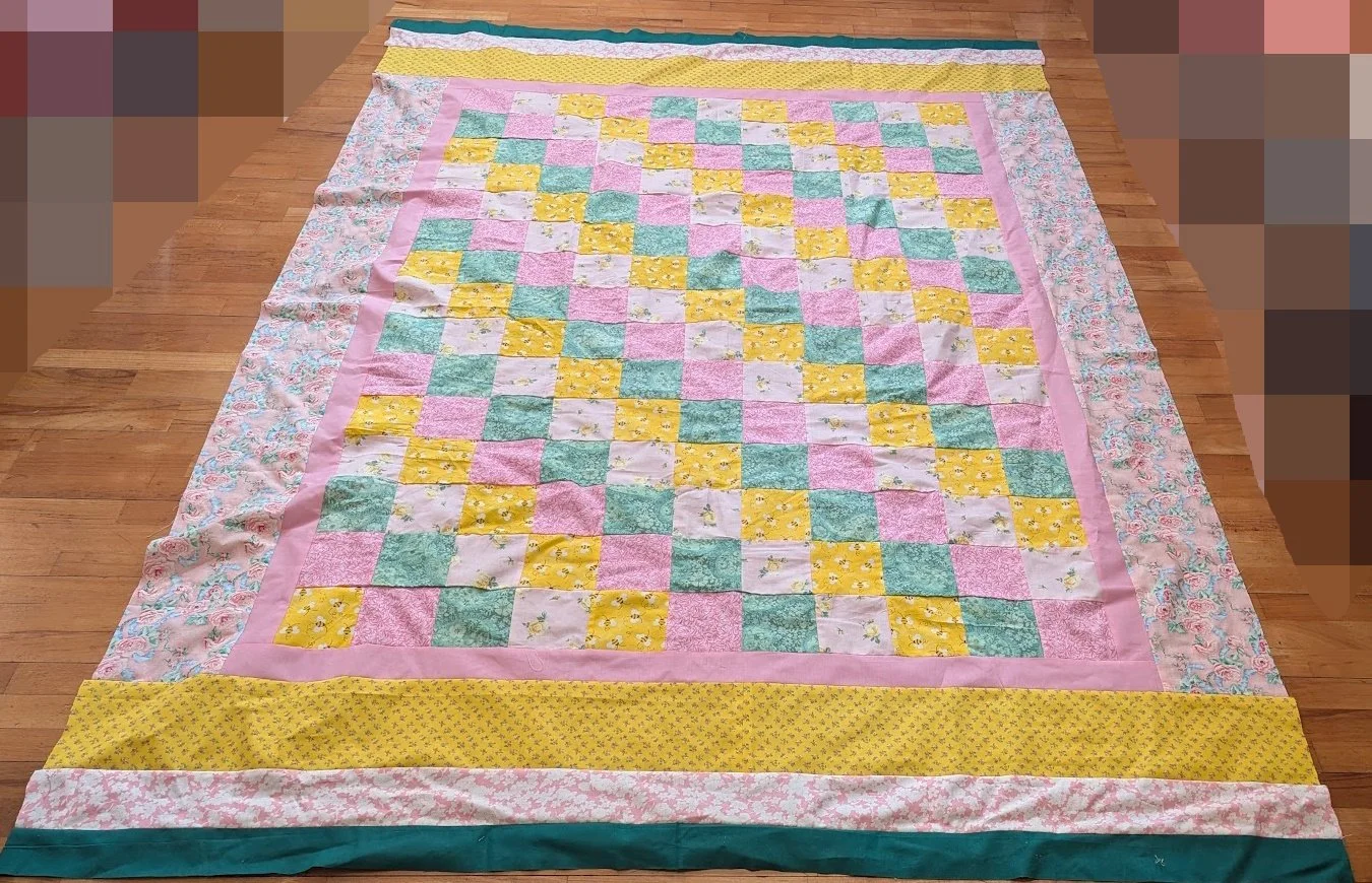 I added borders to the center smallish quilt