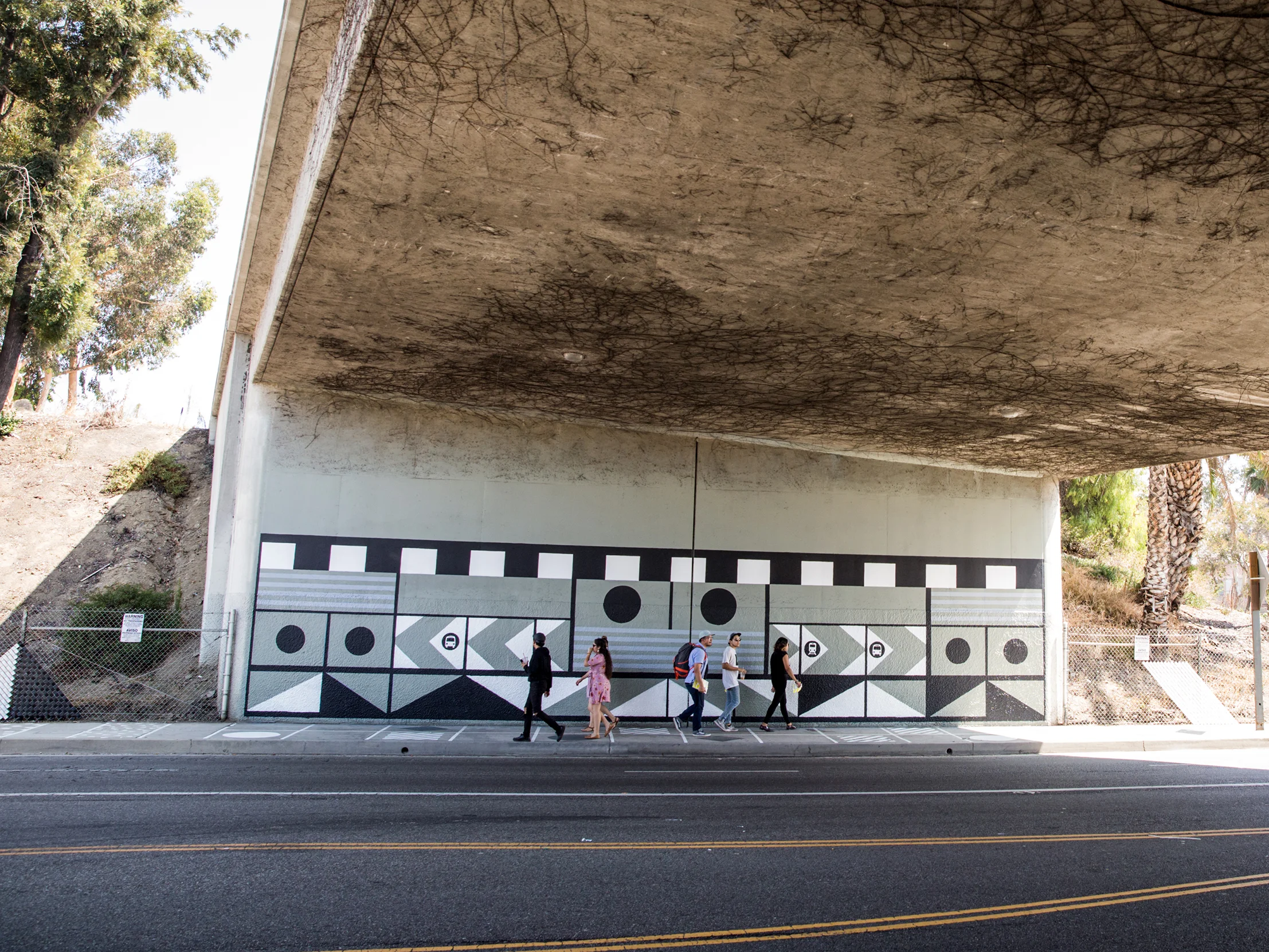After: Murals on Underpass Walls, Sidewalk Patterning, New Fencing with Fence Weave