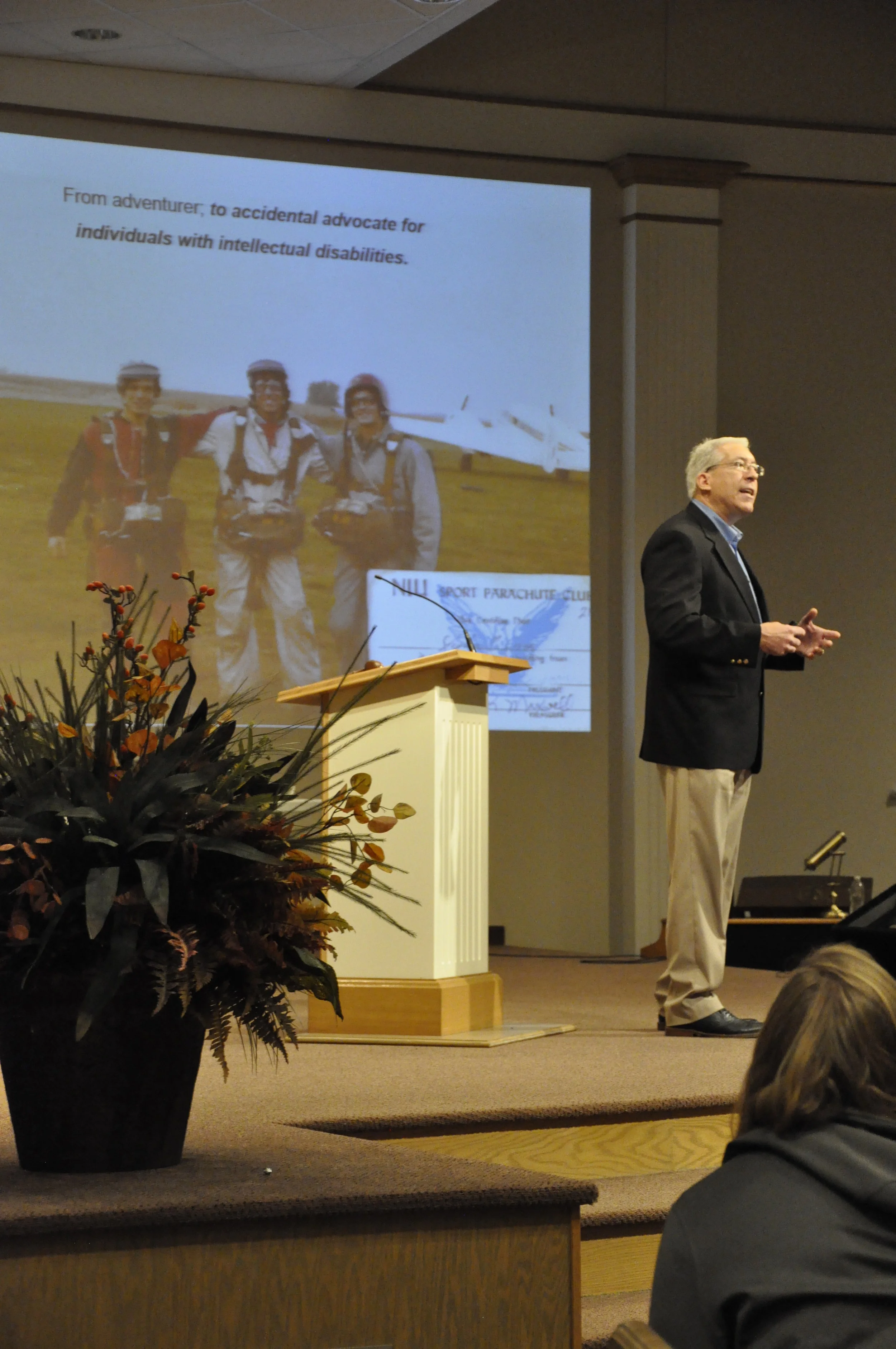 Pictured in the middle of the background photo and presenting on stage is Steve Cerve; from adventurer to accidental advocate.