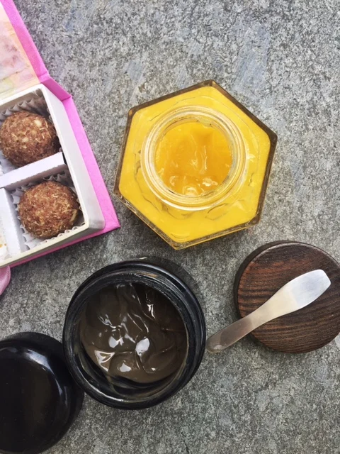 From top left: Superna Trikha's Skin Laddoos, Farmacy Honey Potion, Purearth Mitti. 