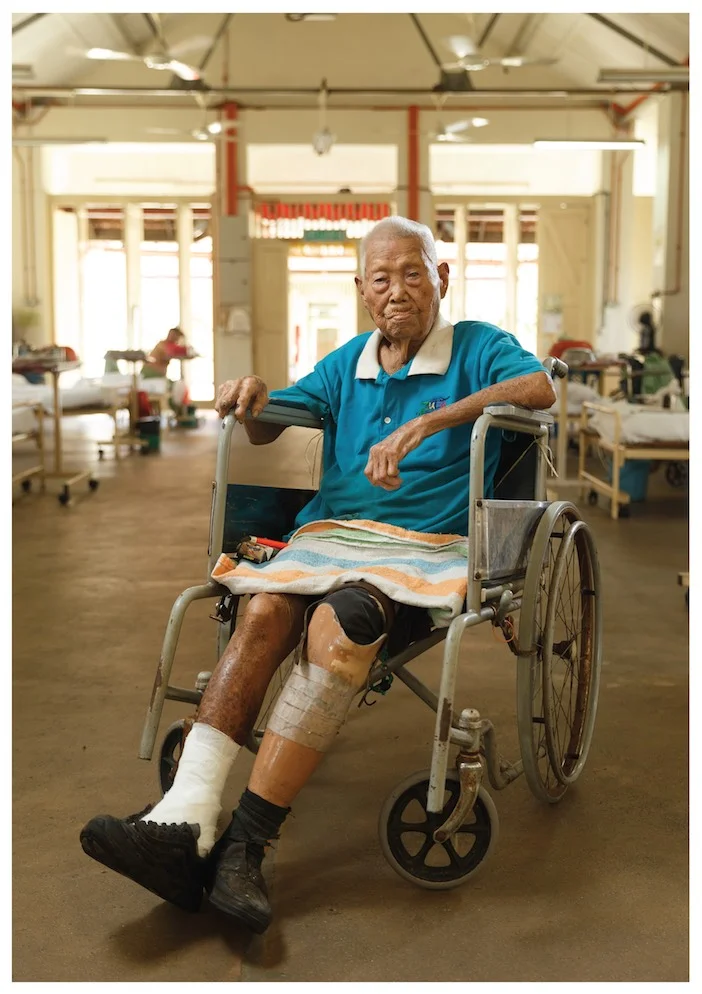 Kong, the dresser who had served at the ward in the early years has now returned to the decrepit ward due to old age. (photo by Mango Loke)