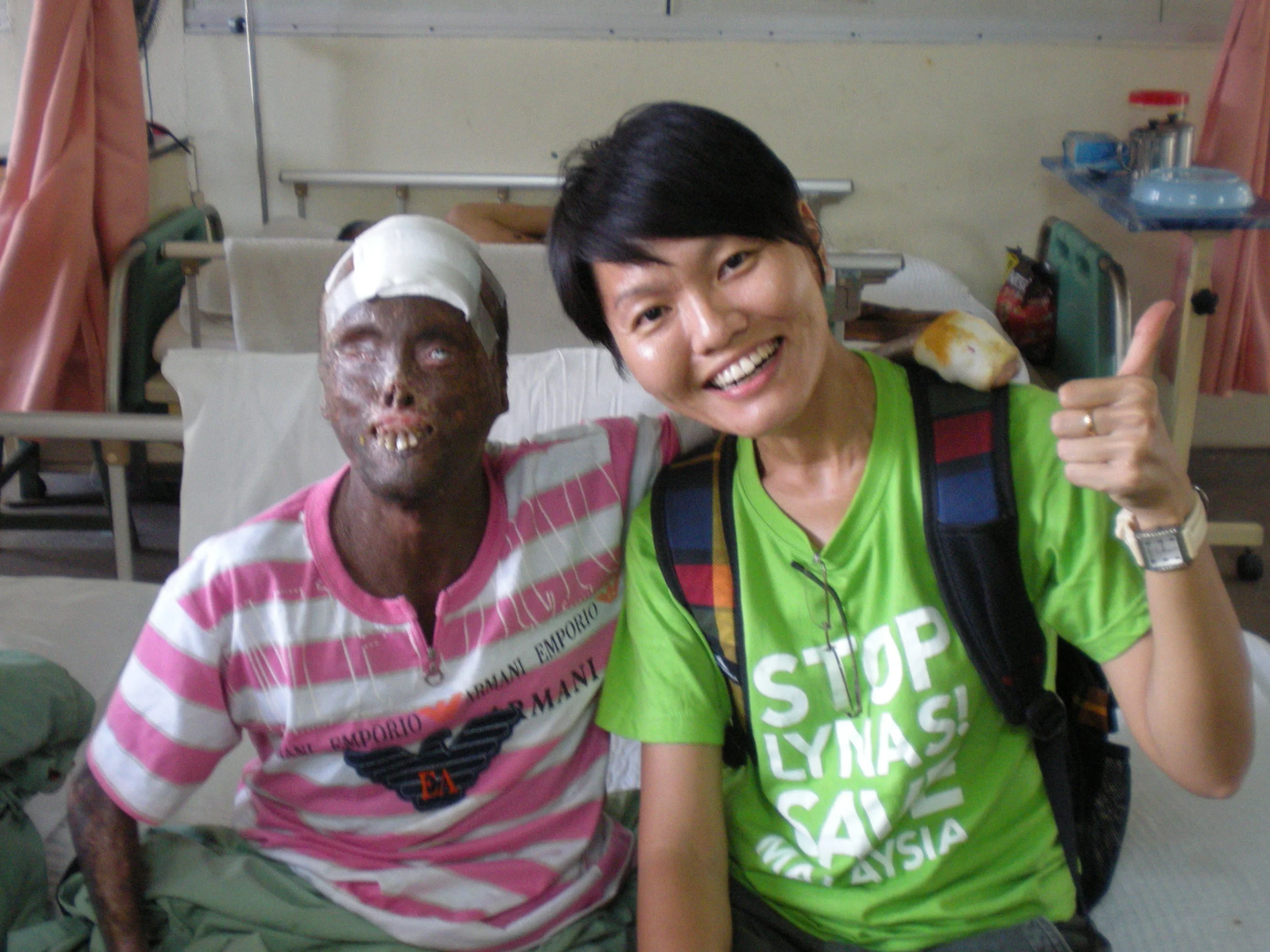 Nordin with his hand around Tan’s shoulder after the interview. (photo by Lim Mei Kim)