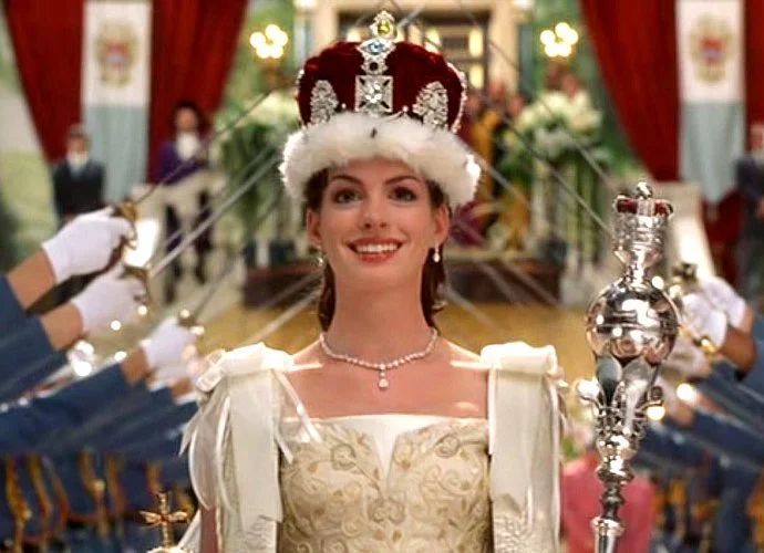 Pictured: Hathaway in full TPD glory as a literal queen