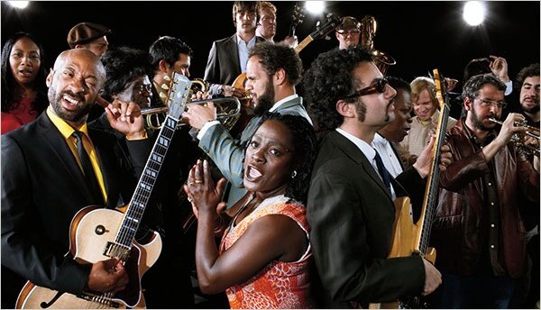 The Family Daptone: Gabriel Roth (with shades), bassist, producer and co-founder of Daptone Records, with various members of the label’s roster, including Sharon Jones (center) and Binky Griptite (left) of the Dap-Kings, as well as members of the Bu…