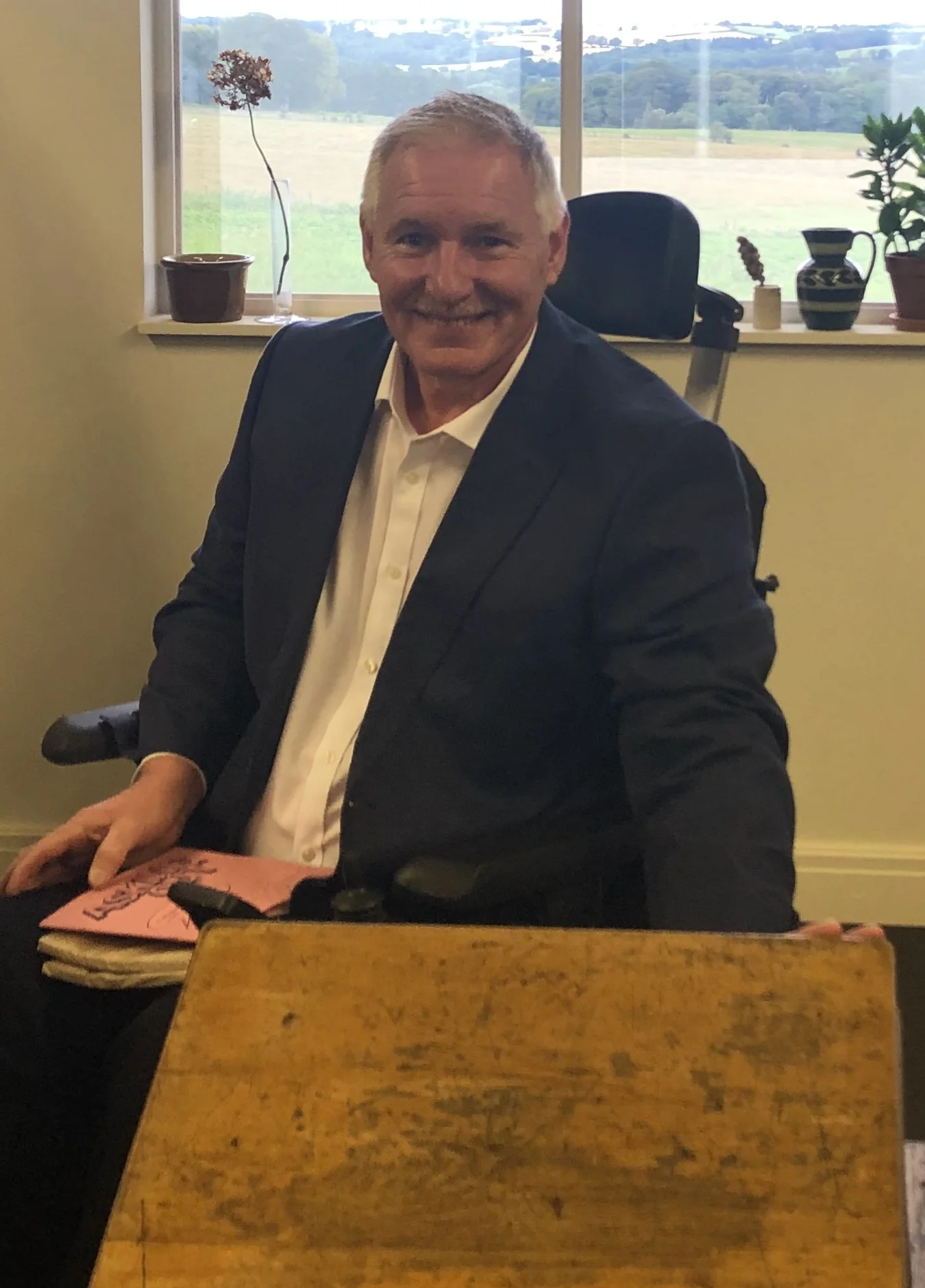 Dave back at his 1972 desk.jpg