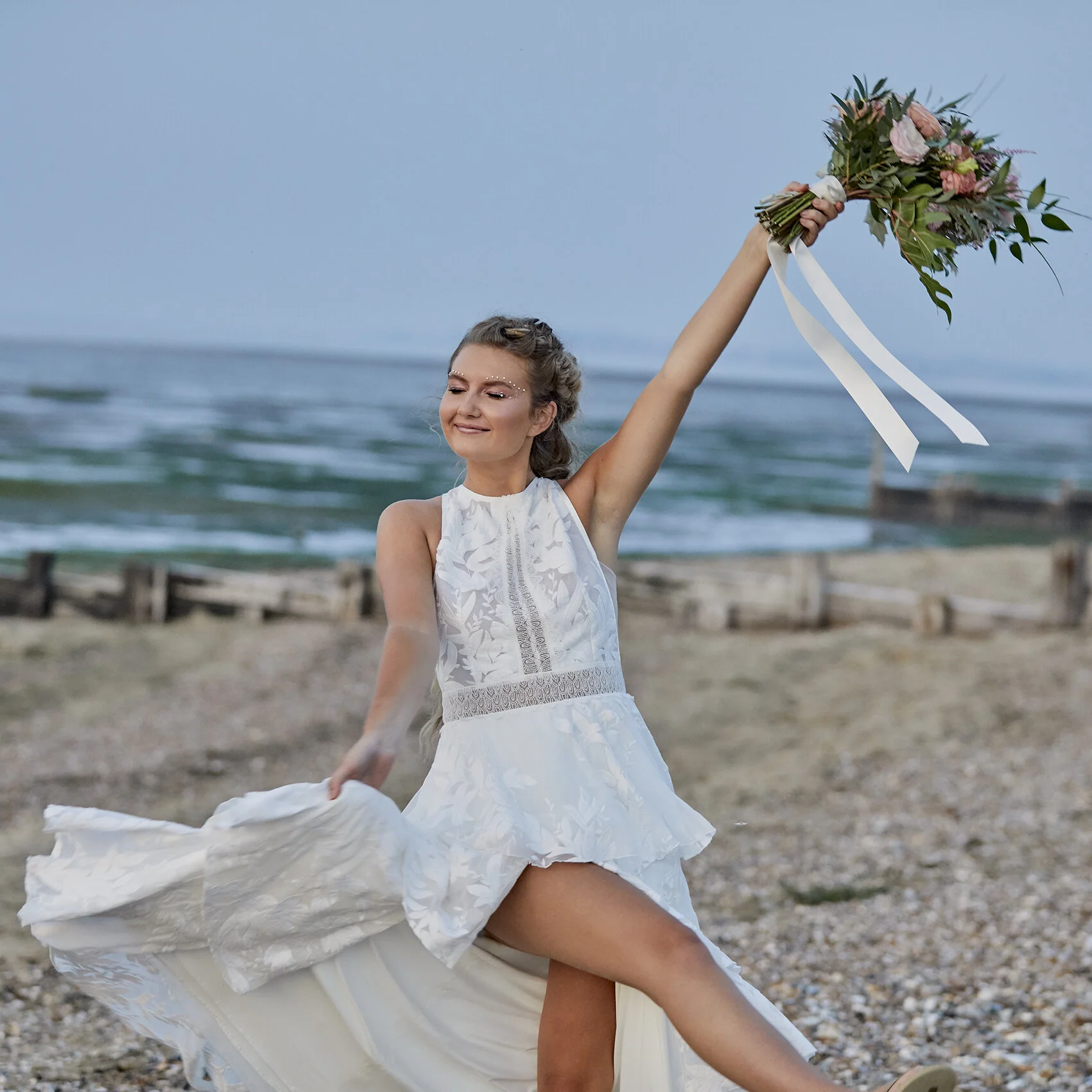 Blissful bride on a beach in Kent