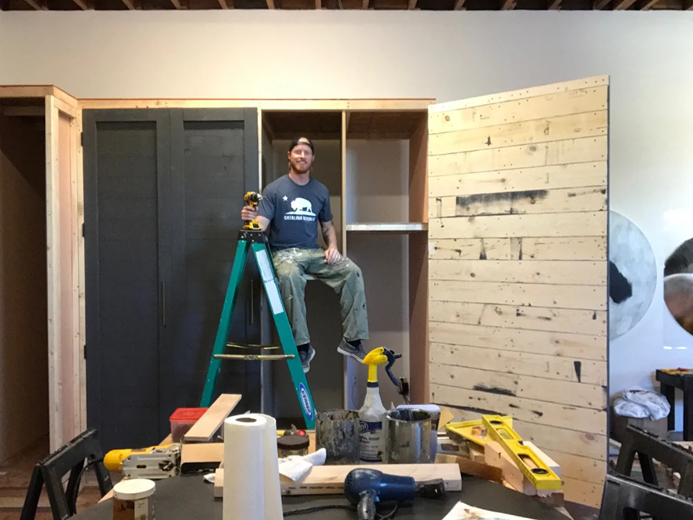 Mike Weber preparing to store his large canvasses