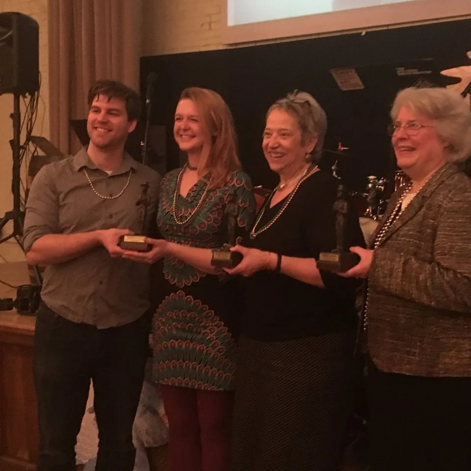 Kathy T. Sheehan & Stacy P. Draper, along with the other Sammy Award winners, holding their awards.