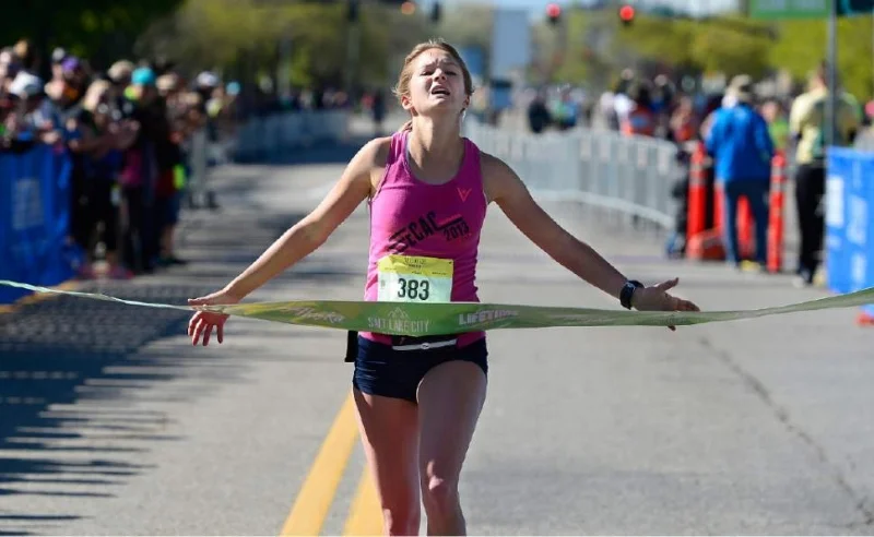 Many people liken giving birth to running a marathon. Nicole Lyons crossing the finish line.