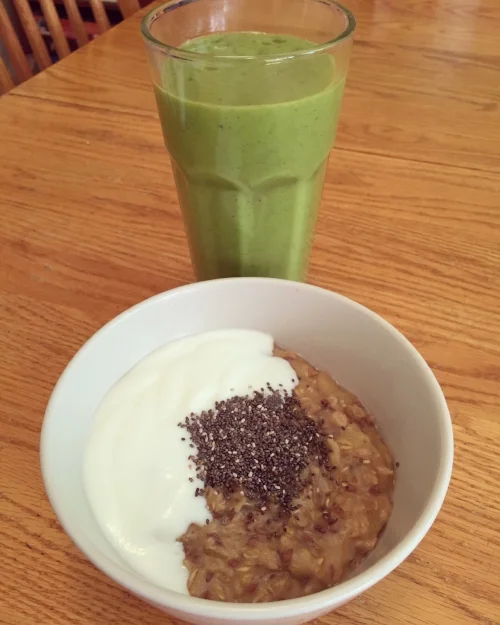 Yummy breakfast example, green smoothie and oatmeal with yogurt and chia seeds