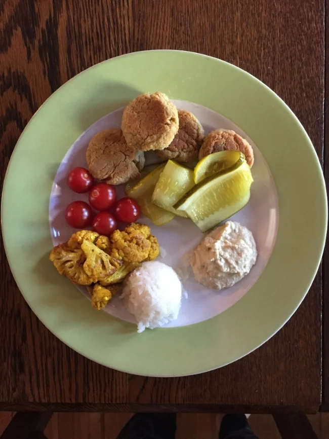 Falafel balls, turmeric baked cauliflower, cherry tomatoes, pickles, coconut rice & hummus. YUM
