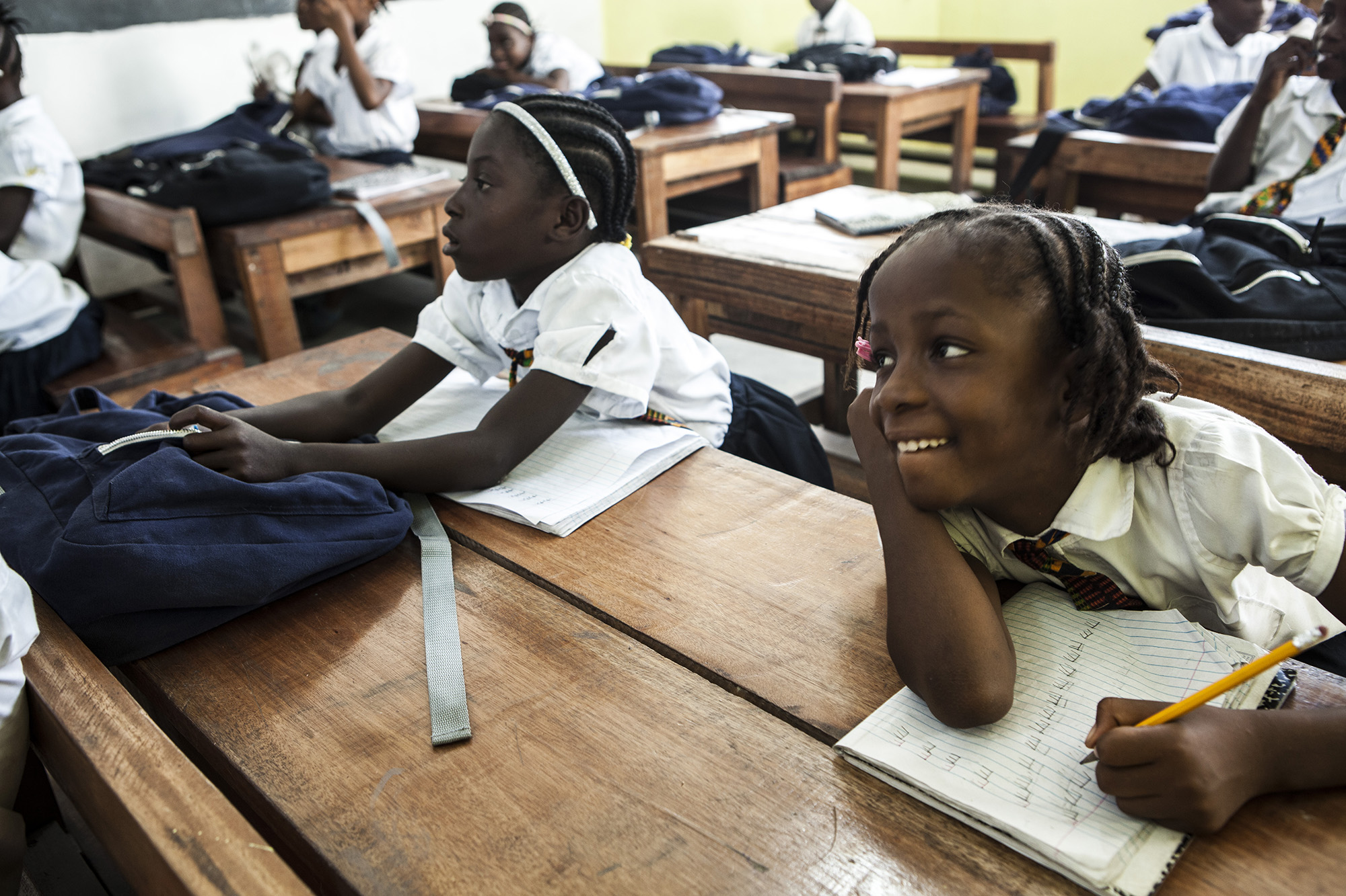 Mercy attends class at a school in Monrovia. “She loves being around her friends. Everyone opens their arms to her. She never acts like anything bad happened to her in the past. She’s always smiling," sayd a teacher of Mercy.