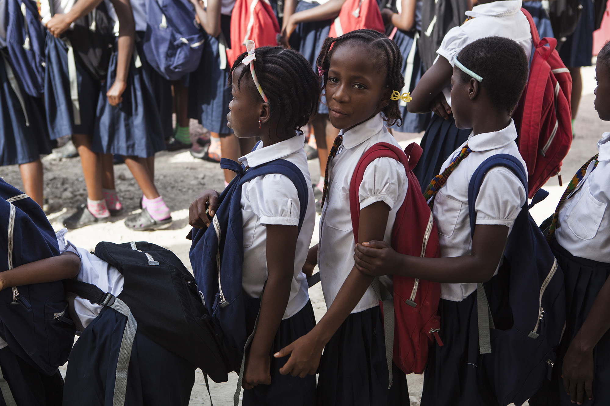 At the age of 9, Mercy, third from right, was given a grant to attend school for the first time in her life. Her mother had never been able to afford to send her to school.