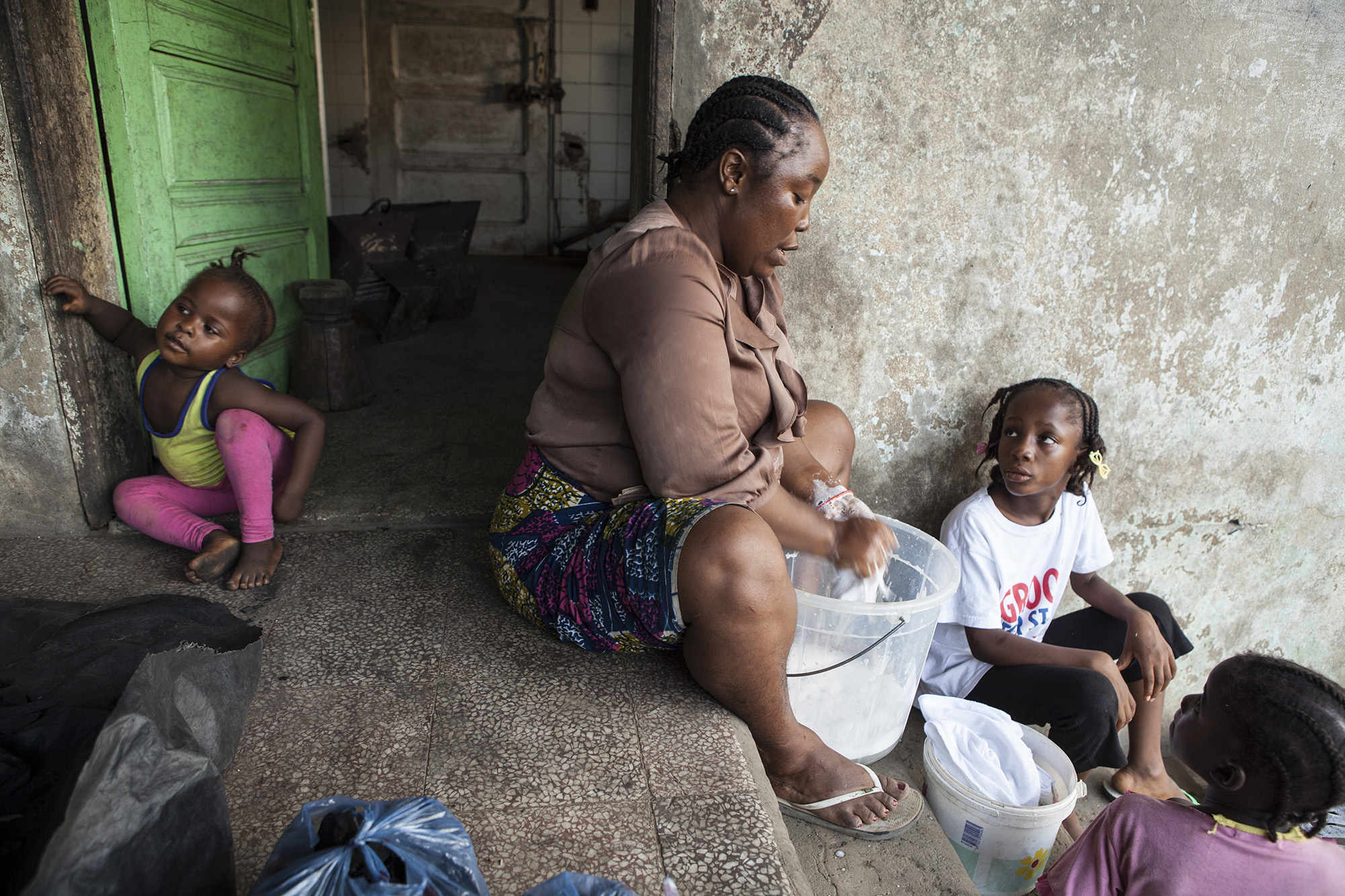 Mercy, right, was later welcomed into the house of Martu Weefor, left, a family friend and neighbor. 