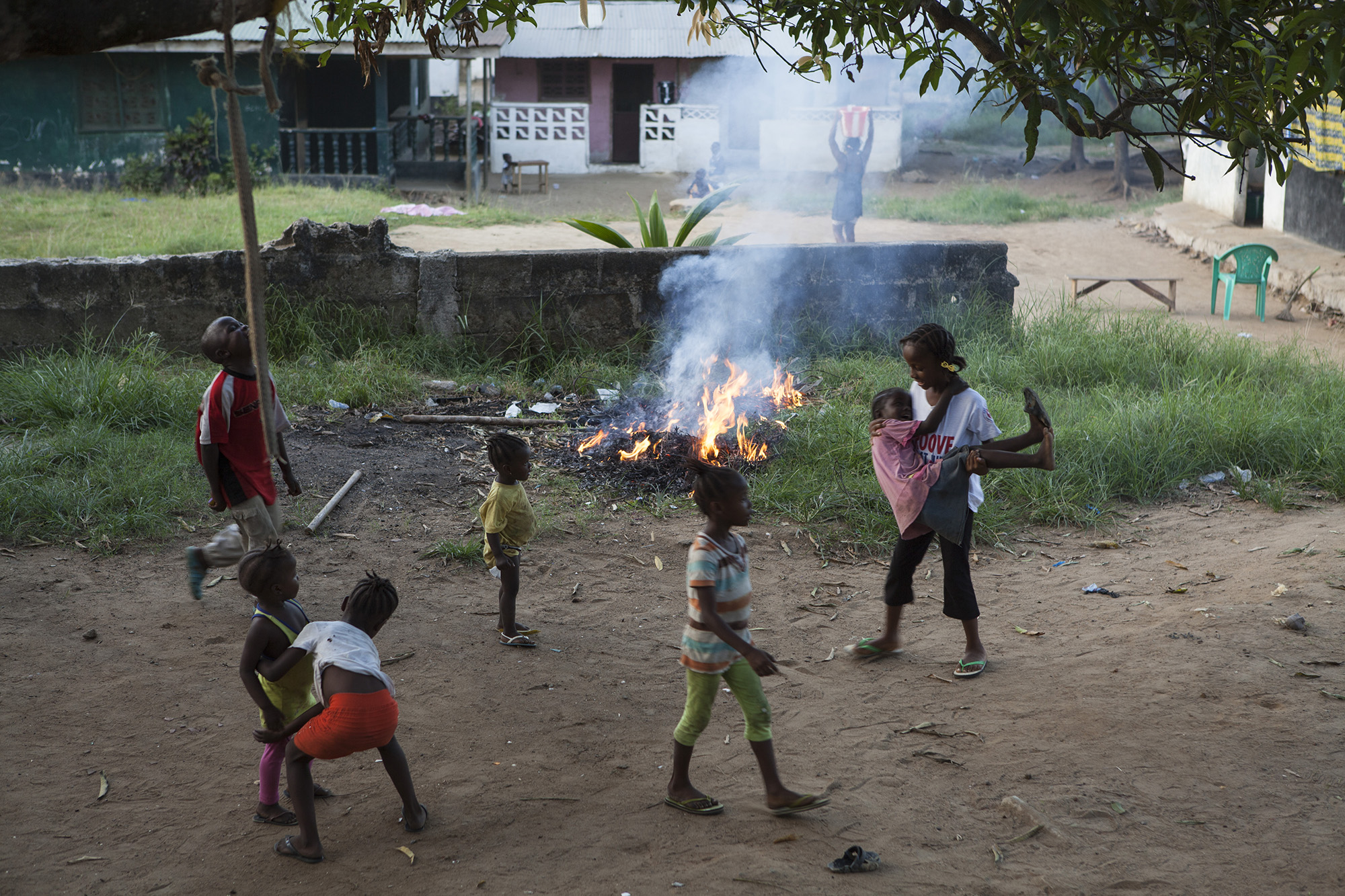 Mercy, right, plays with her friends in her neighborhood. 