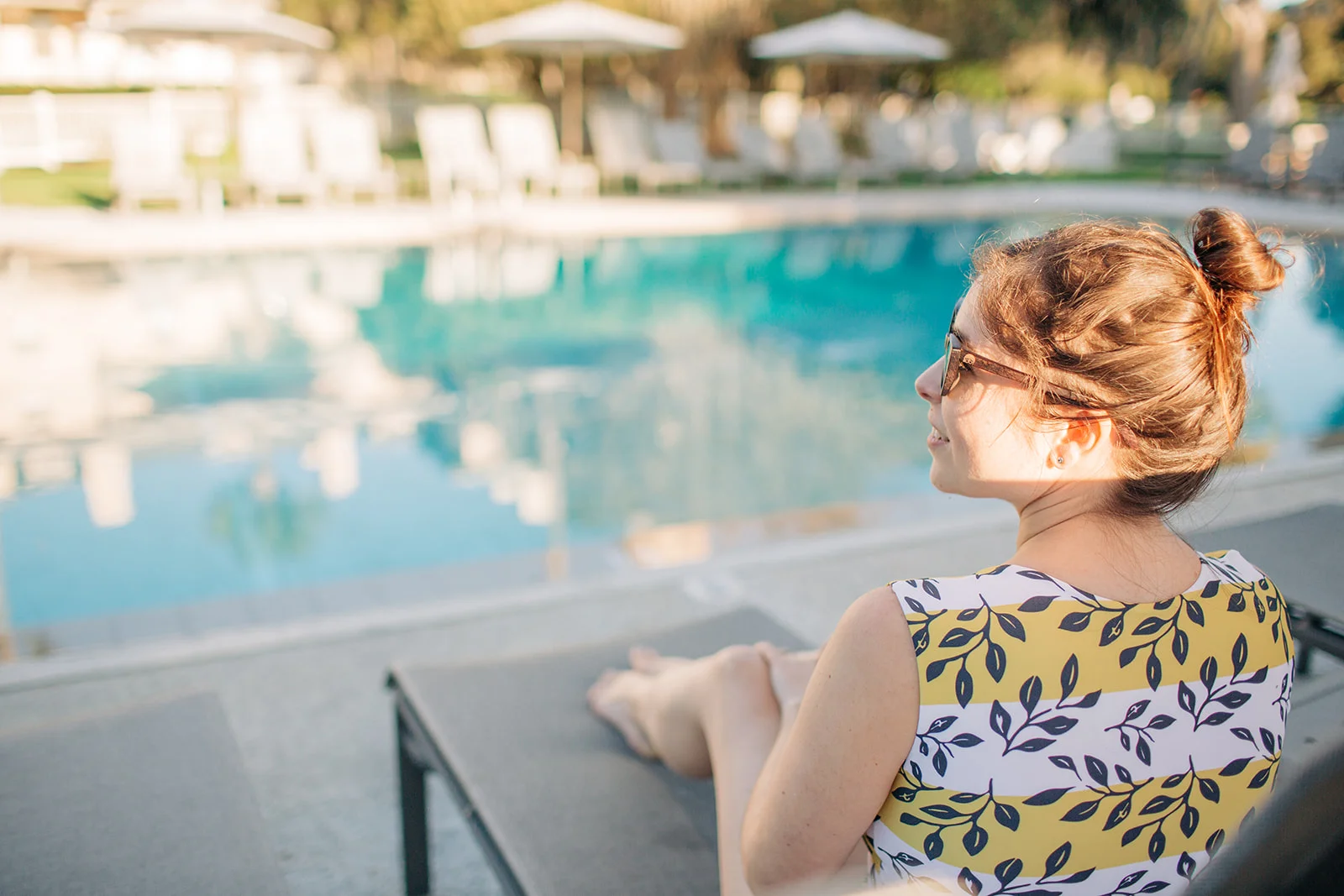 Young woman lounging at the Jekyll Island Club Pool