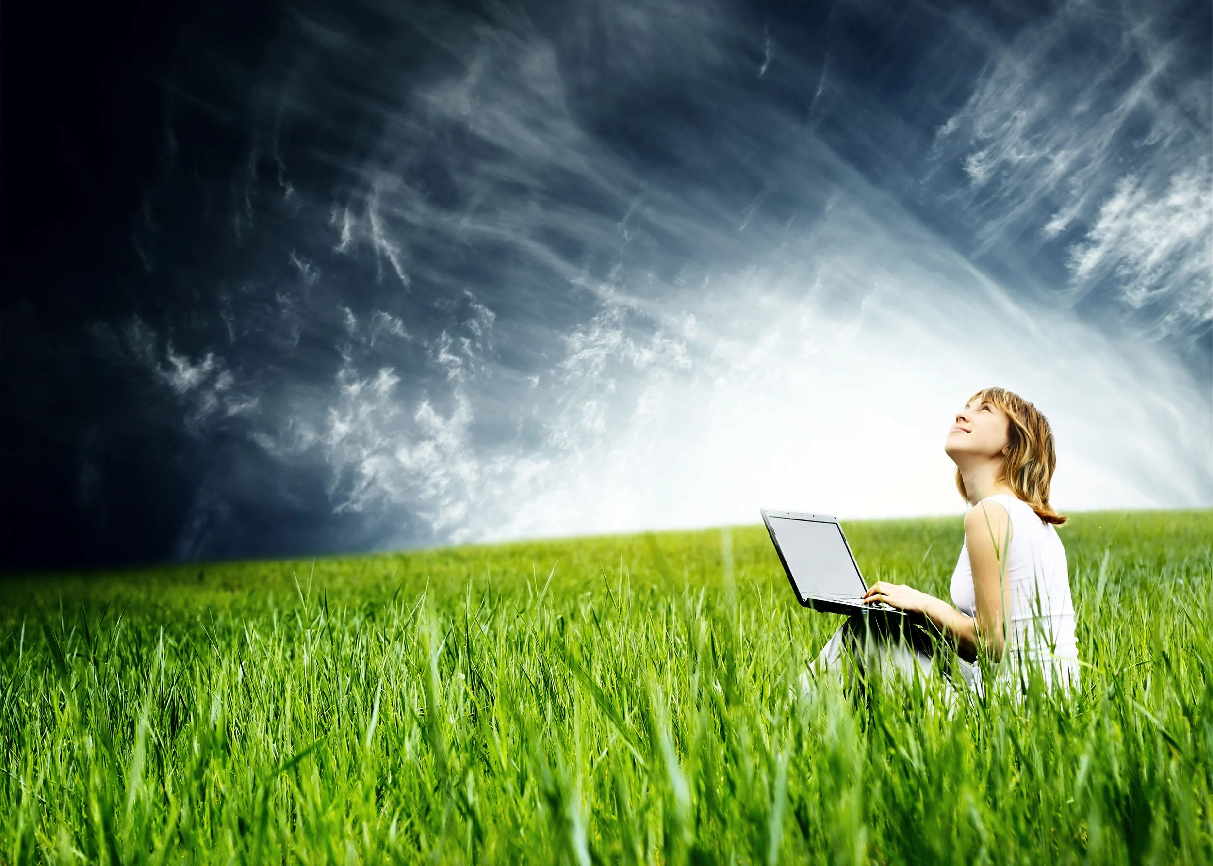 Girl in field with computer_SMALL.jpg