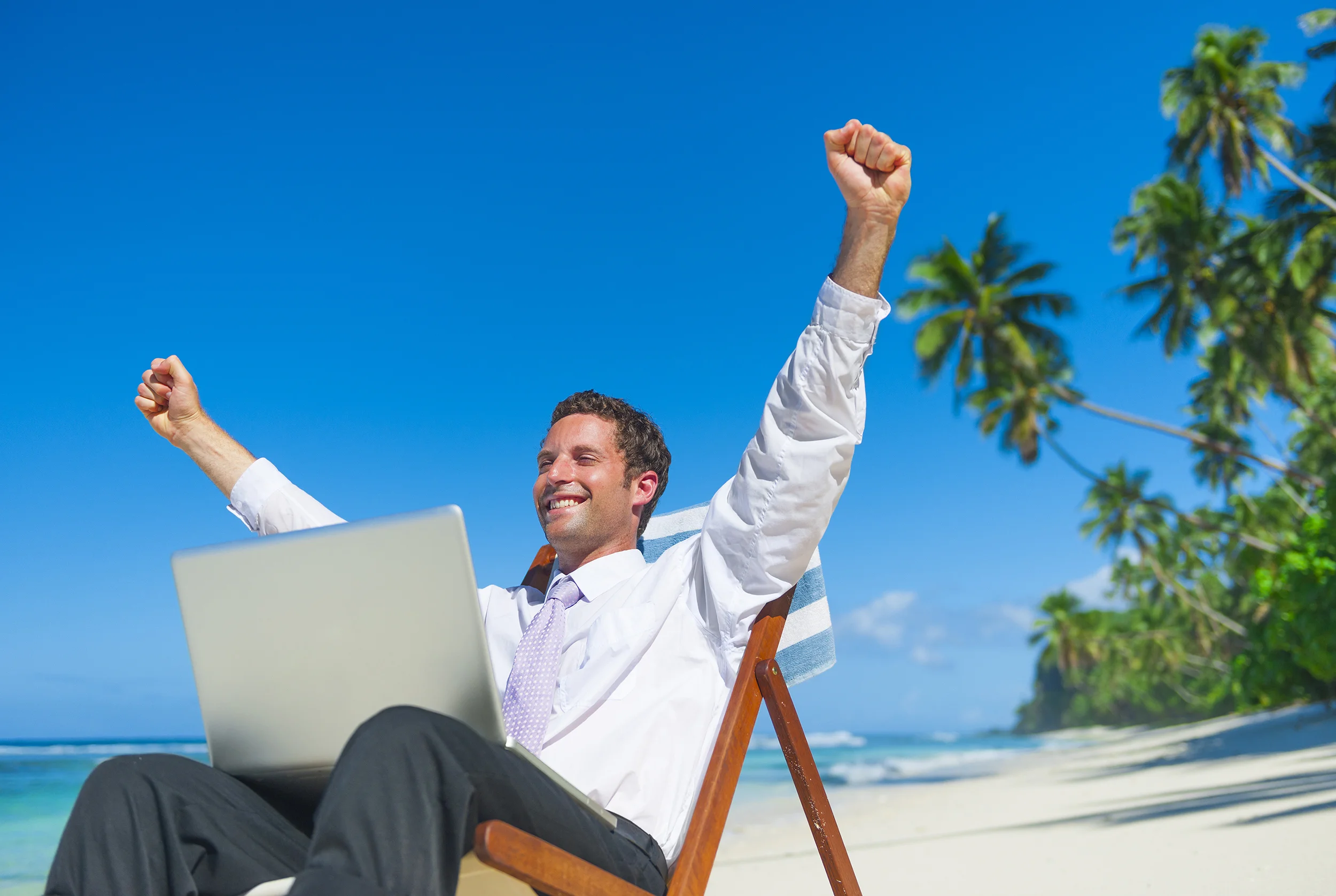 Man on beach with computer_SMALL.jpg
