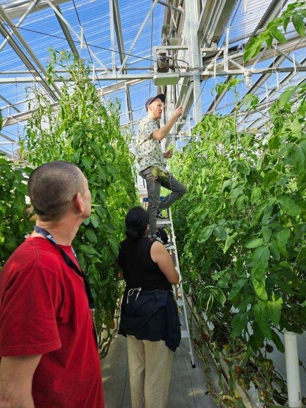 Joe Delgado, Becky Gomez and Dr. Triston Hooks (on ladder)