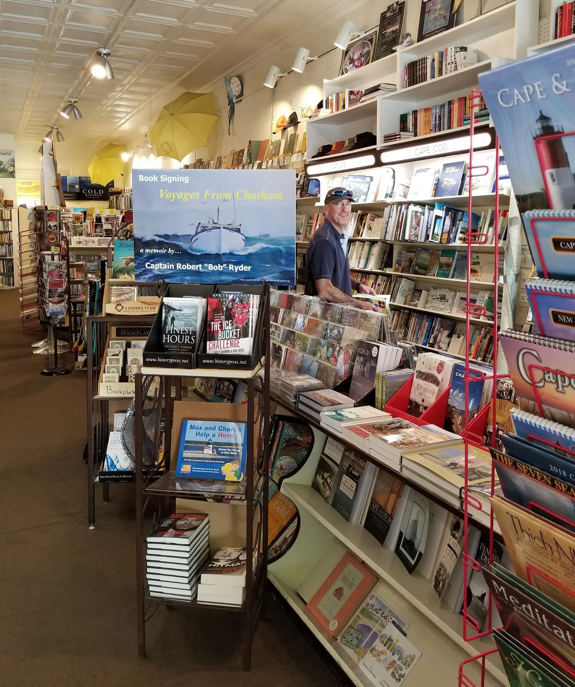 Emily's gentleman caller - aka Jim - exploring Yellow Umbrella Books in Chatham, MA