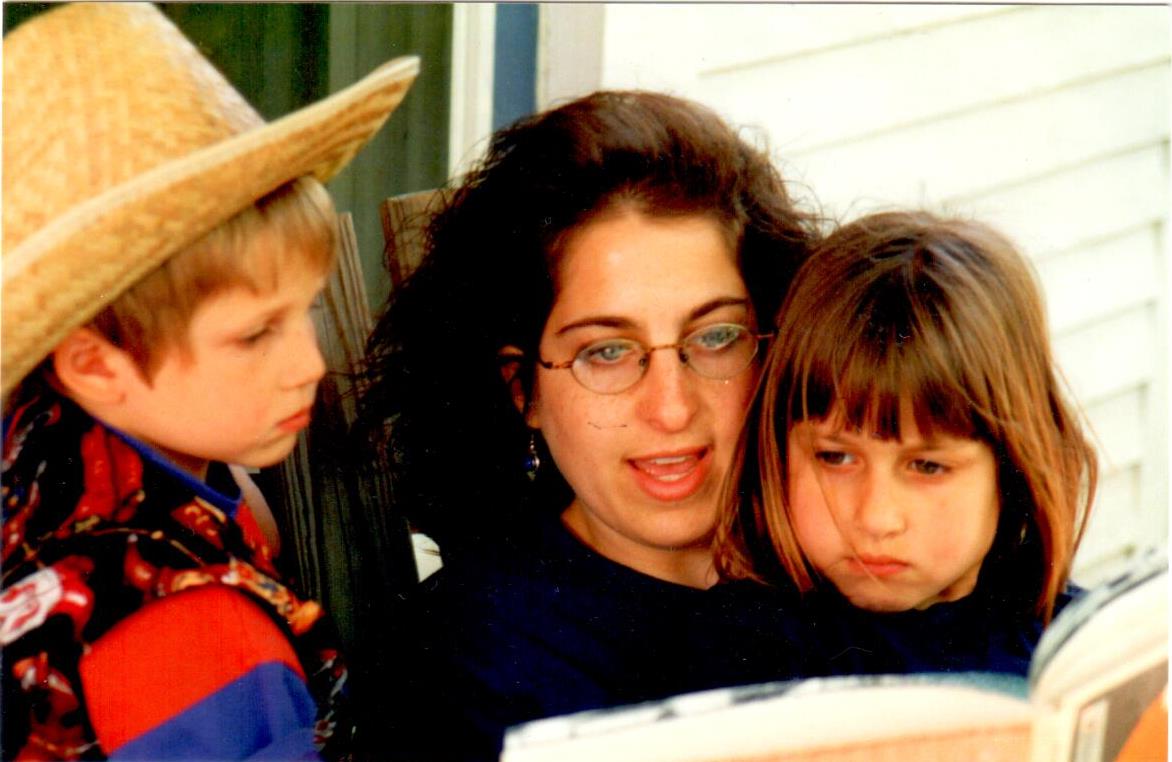 Emily reading to her kids, Rachel and Jacob, circa 1996.