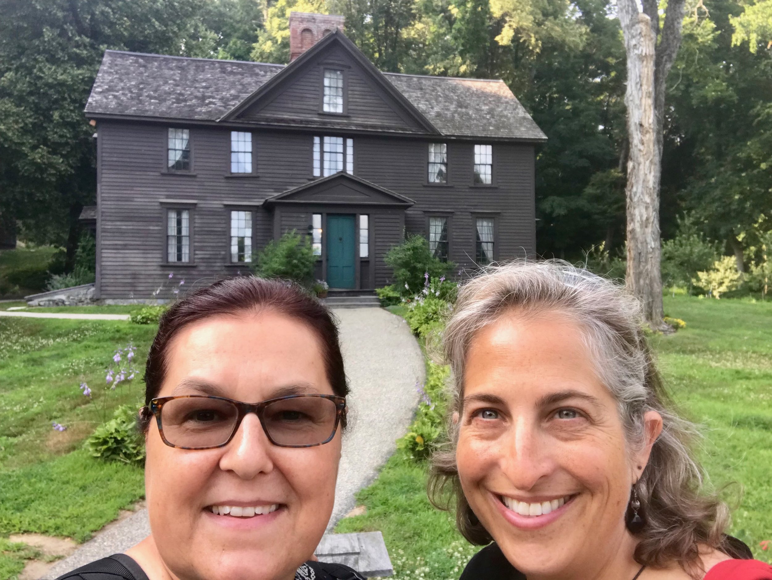 Chris and Emily on a joint jaunt in Concord, MA. Standing in front of the Orchard House - Louisa May Alcott's family home where she penned Little Women .