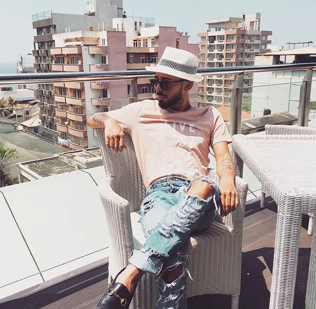 Photo courtesy of Dmitri Ruwan wearing Gucci loafers and H & M distressed jeans. 