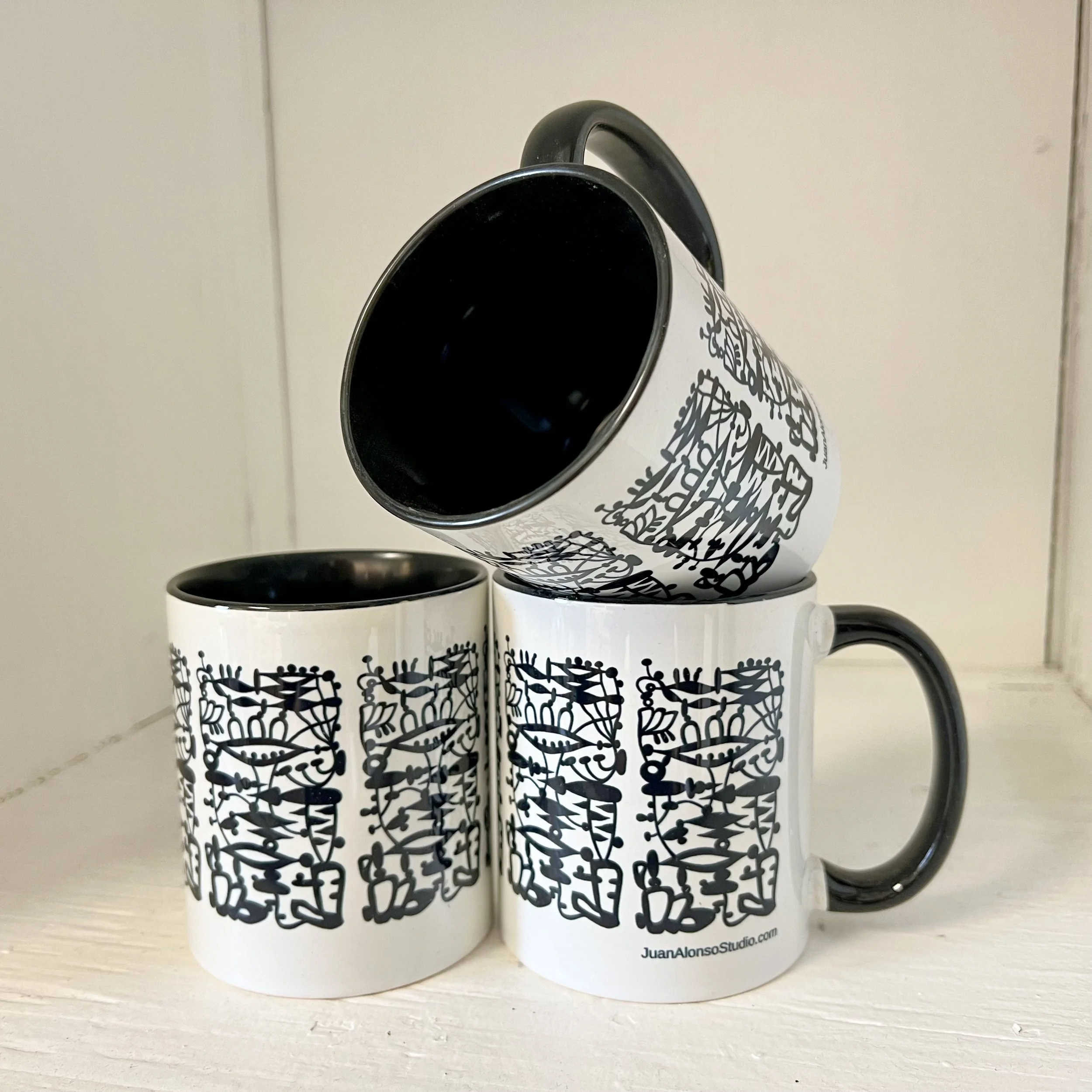 black & white patterned mug with black inside