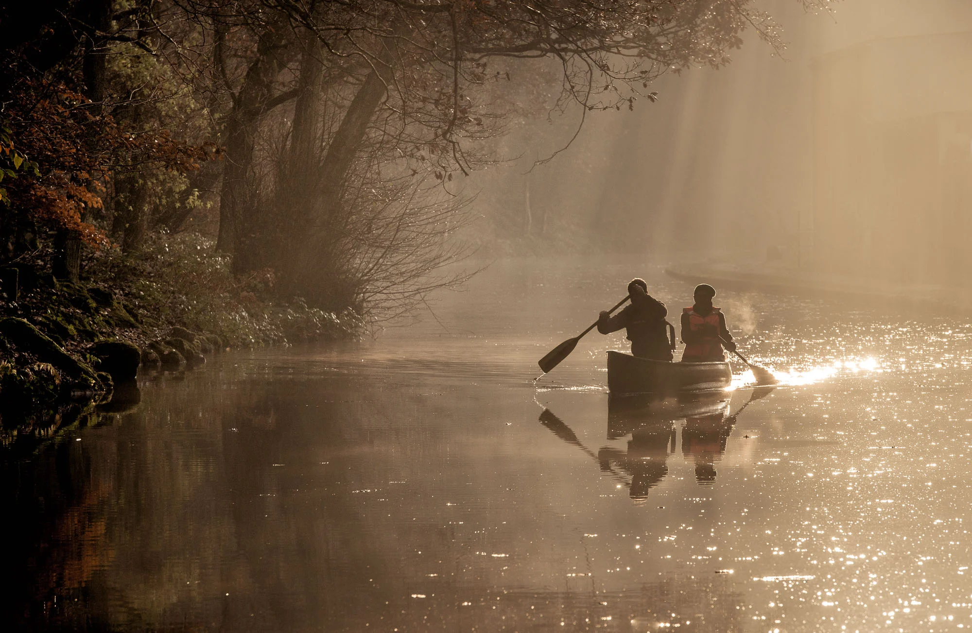 Canoeists in the mist